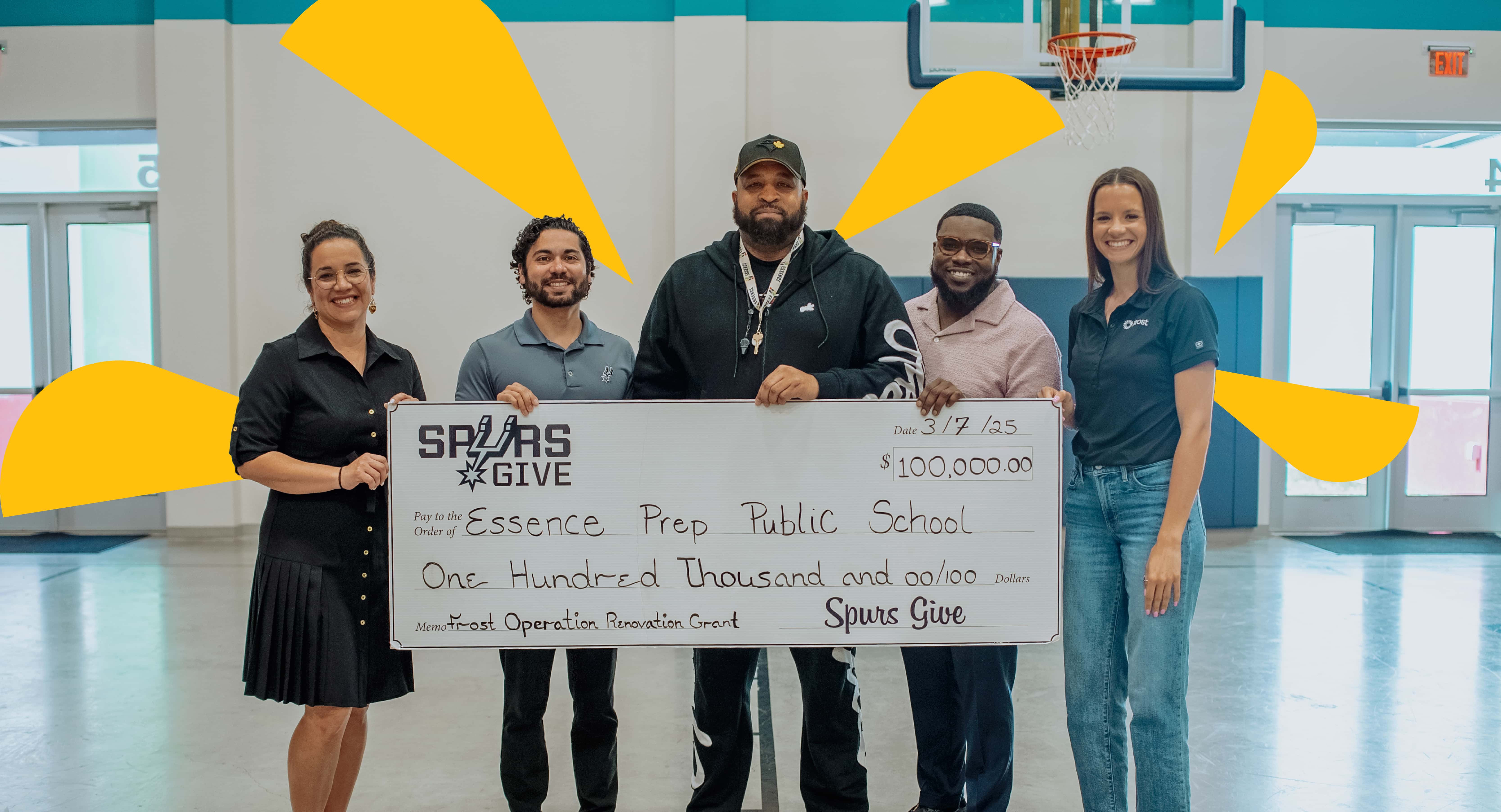 Group of people holding giant check
