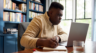 Image of man working on laptop