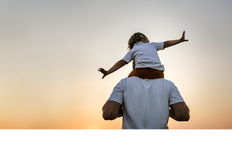 Image of child on father's shoulders