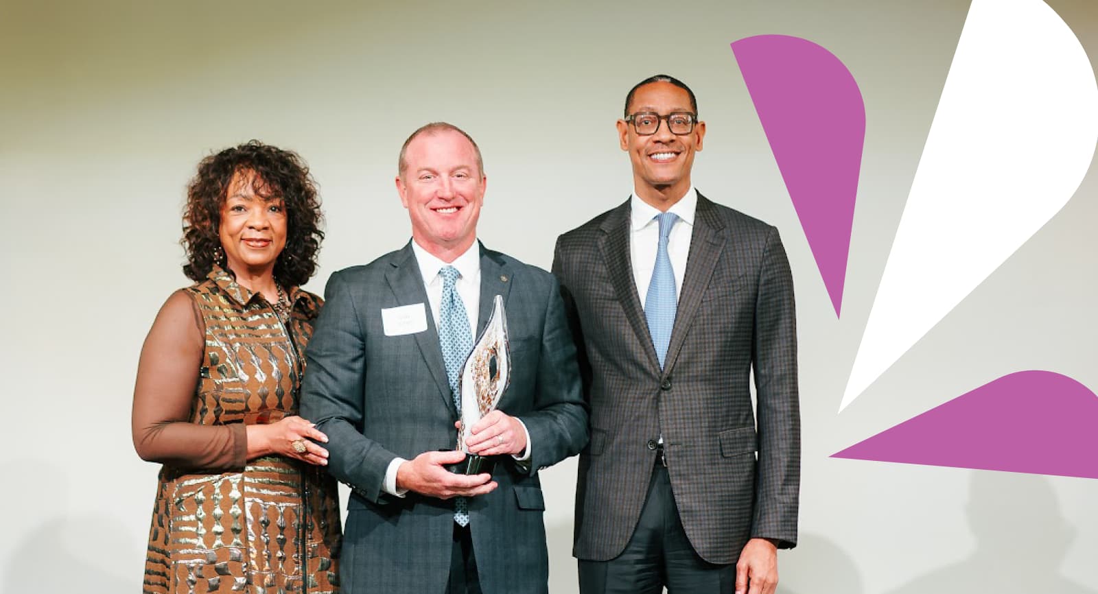 People holding an award