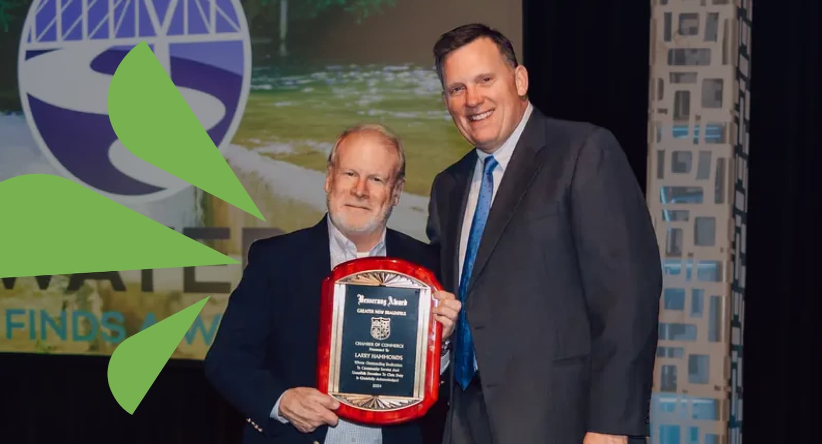 Photo of two men with an award